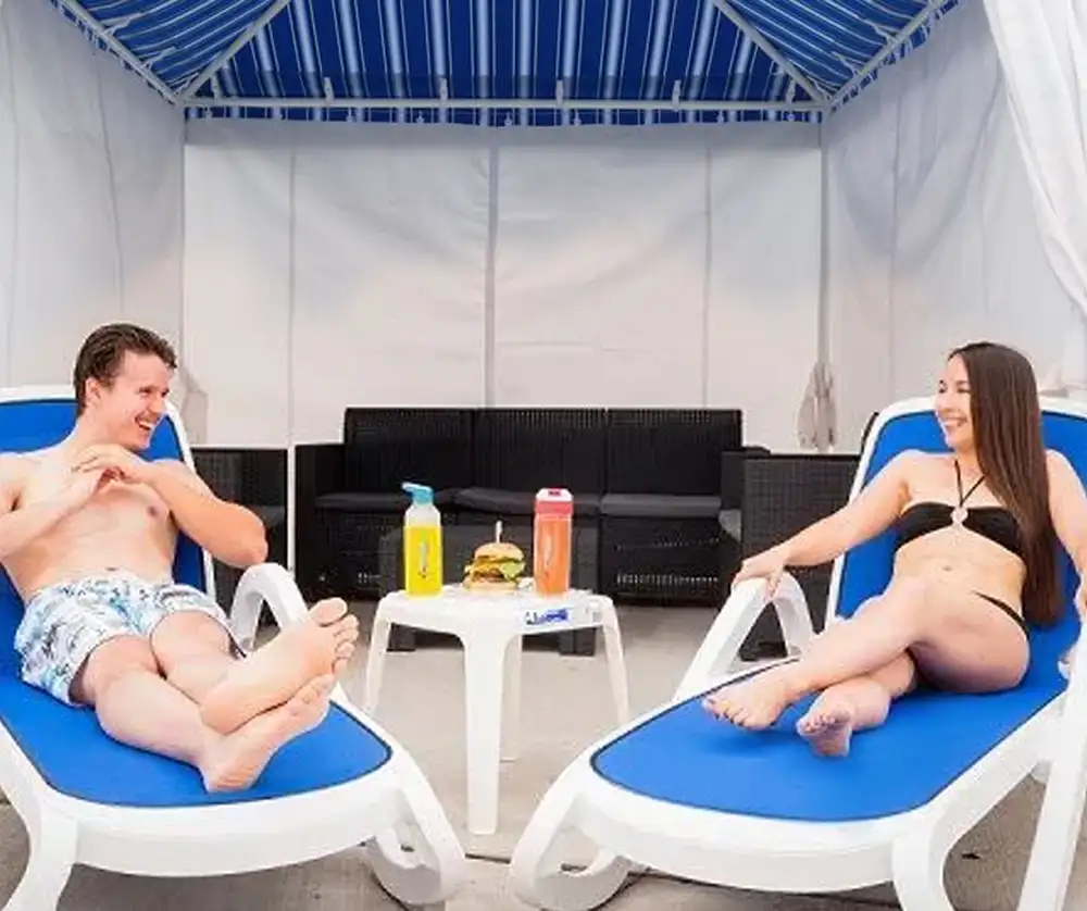 couple-resting-in-private-cabana